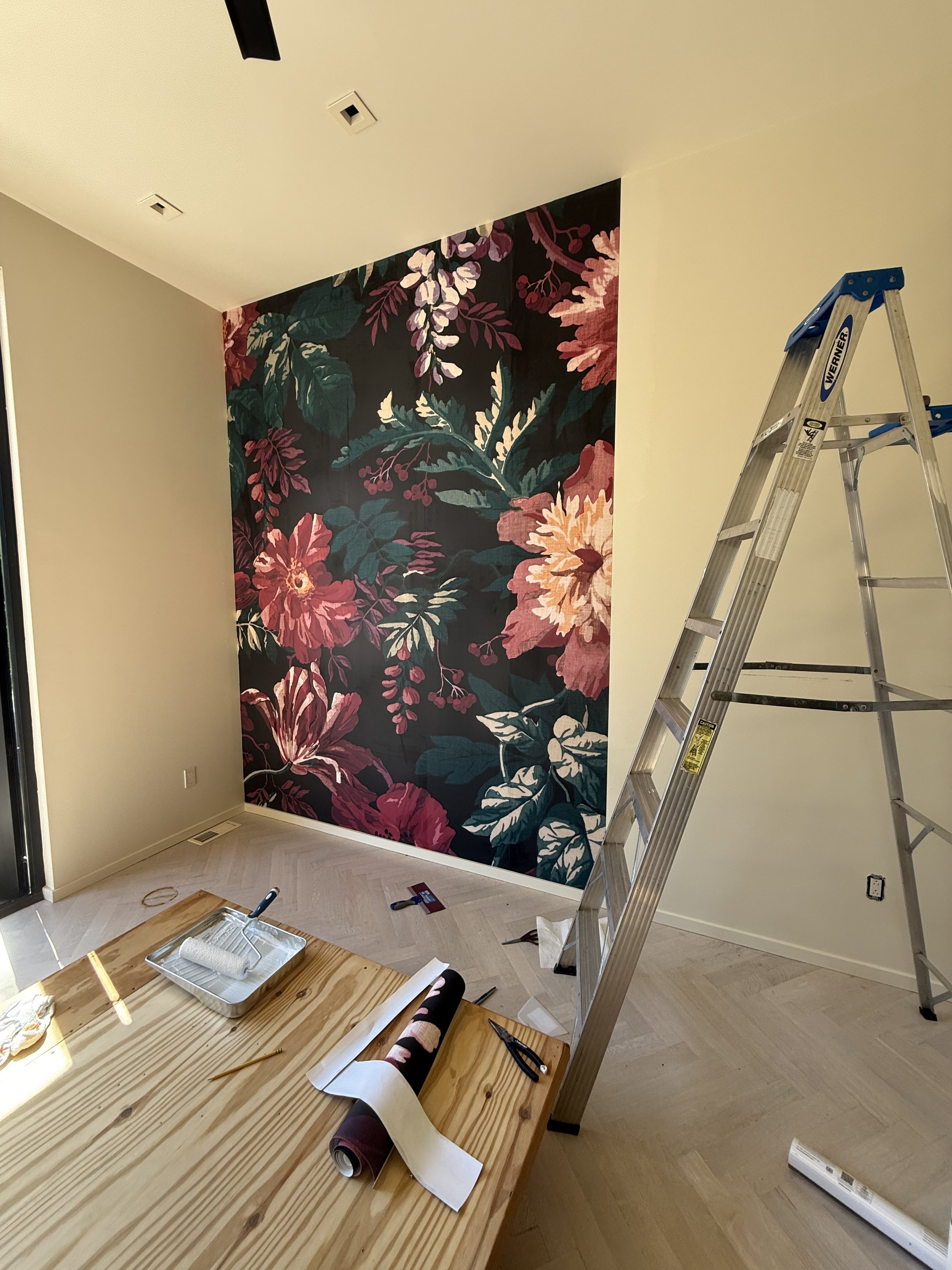 Professional wallpaper installation in progress